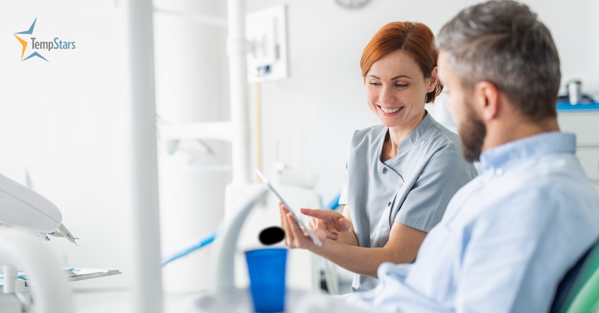 dental assistant talking to patient